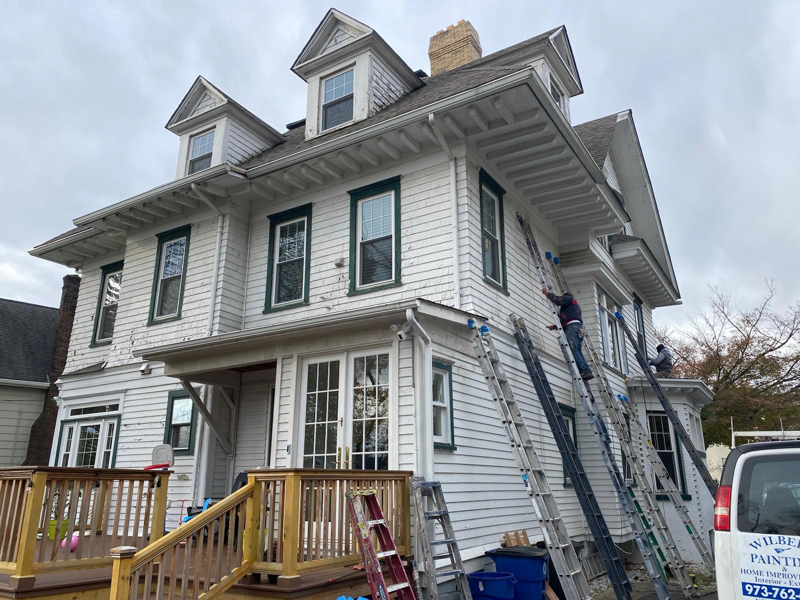 Exterior sanding and paint in progress — photo 2 of 9