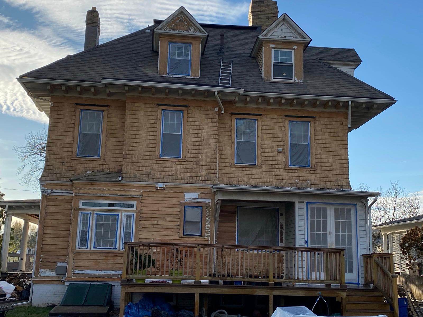 Exterior sanding and paint in progress — photo 4 of 9