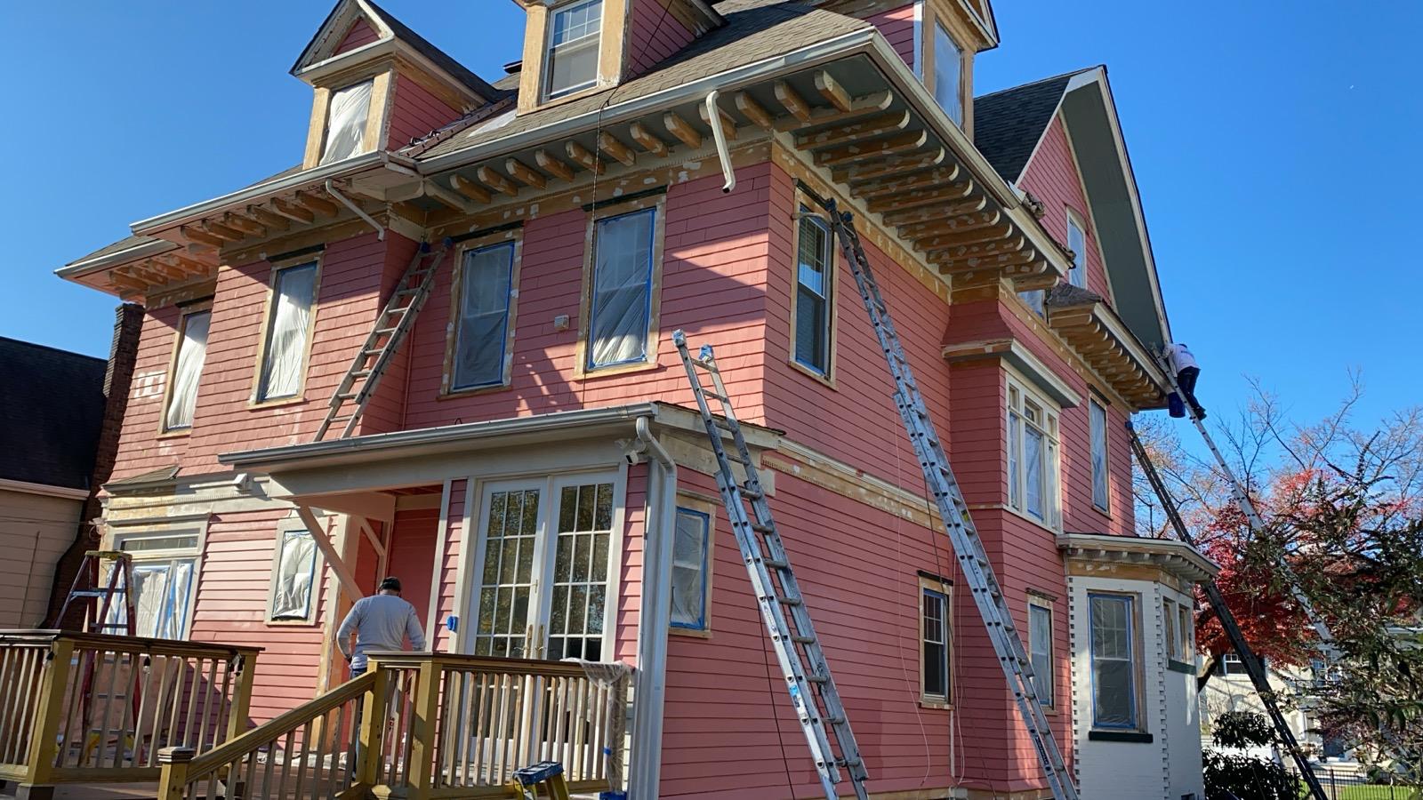 Exterior sanding and paint in progress — photo 6 of 9