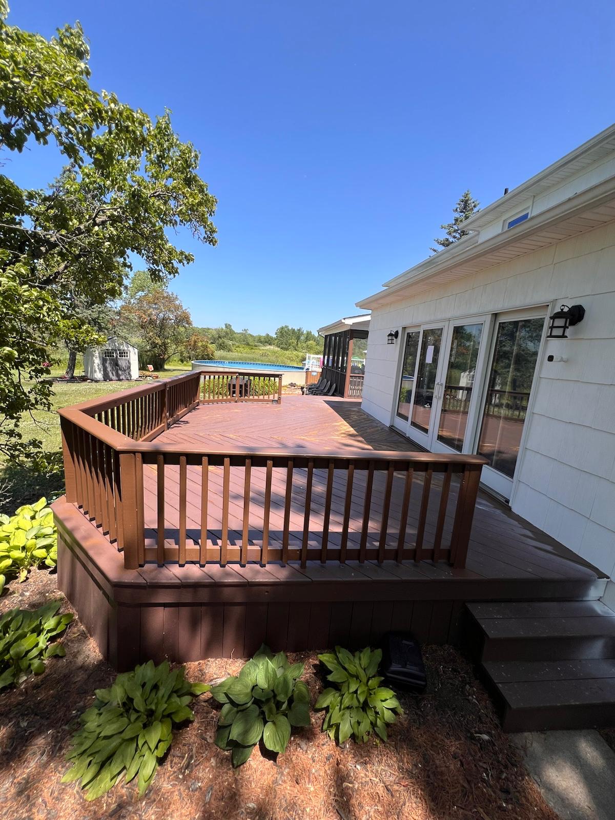 Exterior deck painting in progress — photo 2 of 5