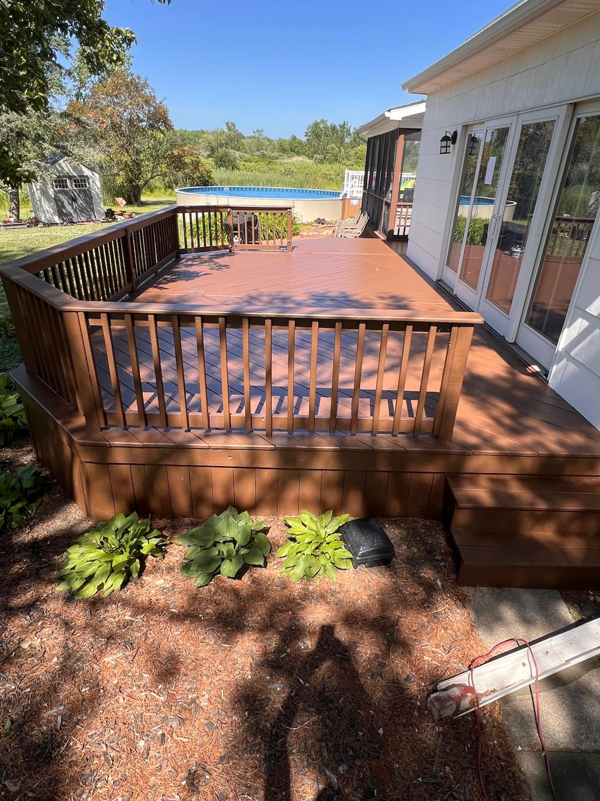Exterior deck painting in progress — photo 3 of 5