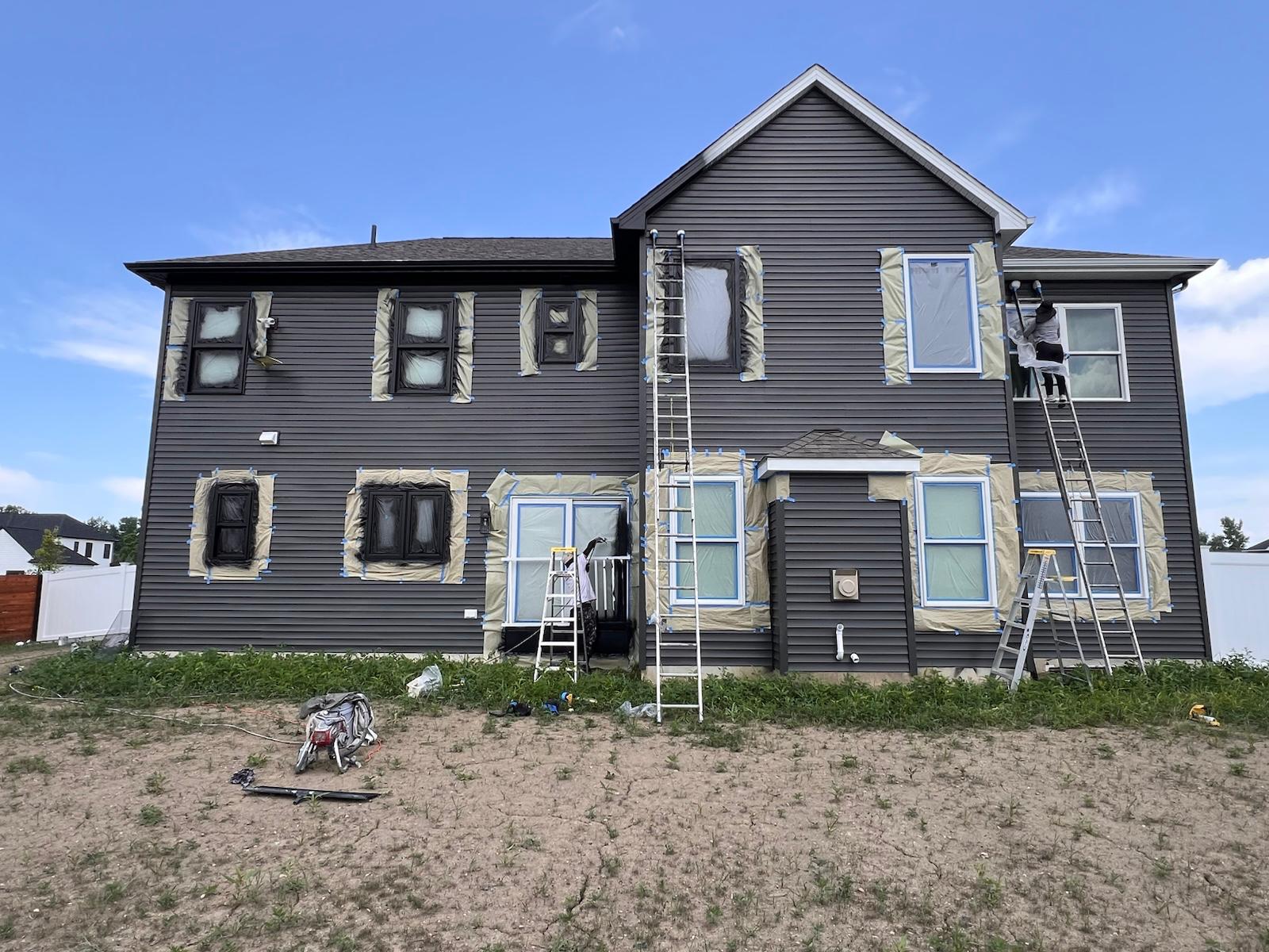 Exterior prep and painting in progress — photo 2 of 4