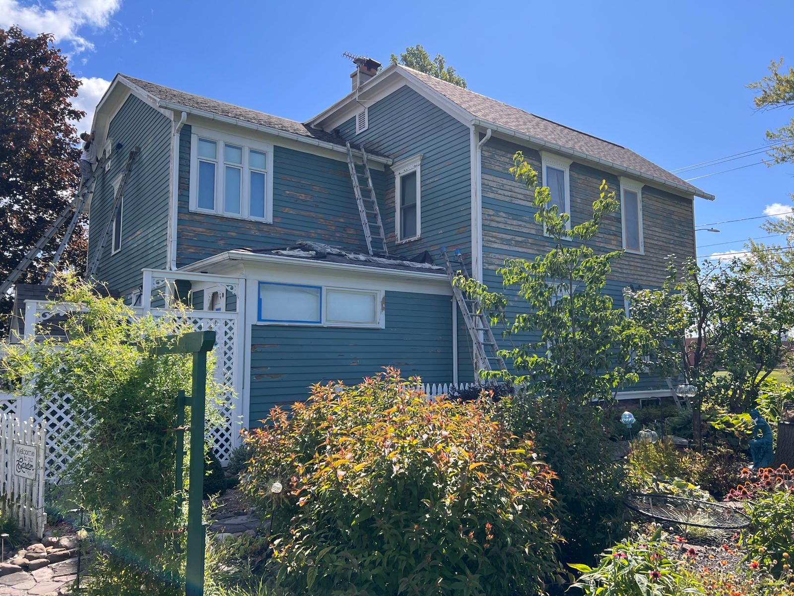 Exterior scraping and prep in progress — photo 4 of 10