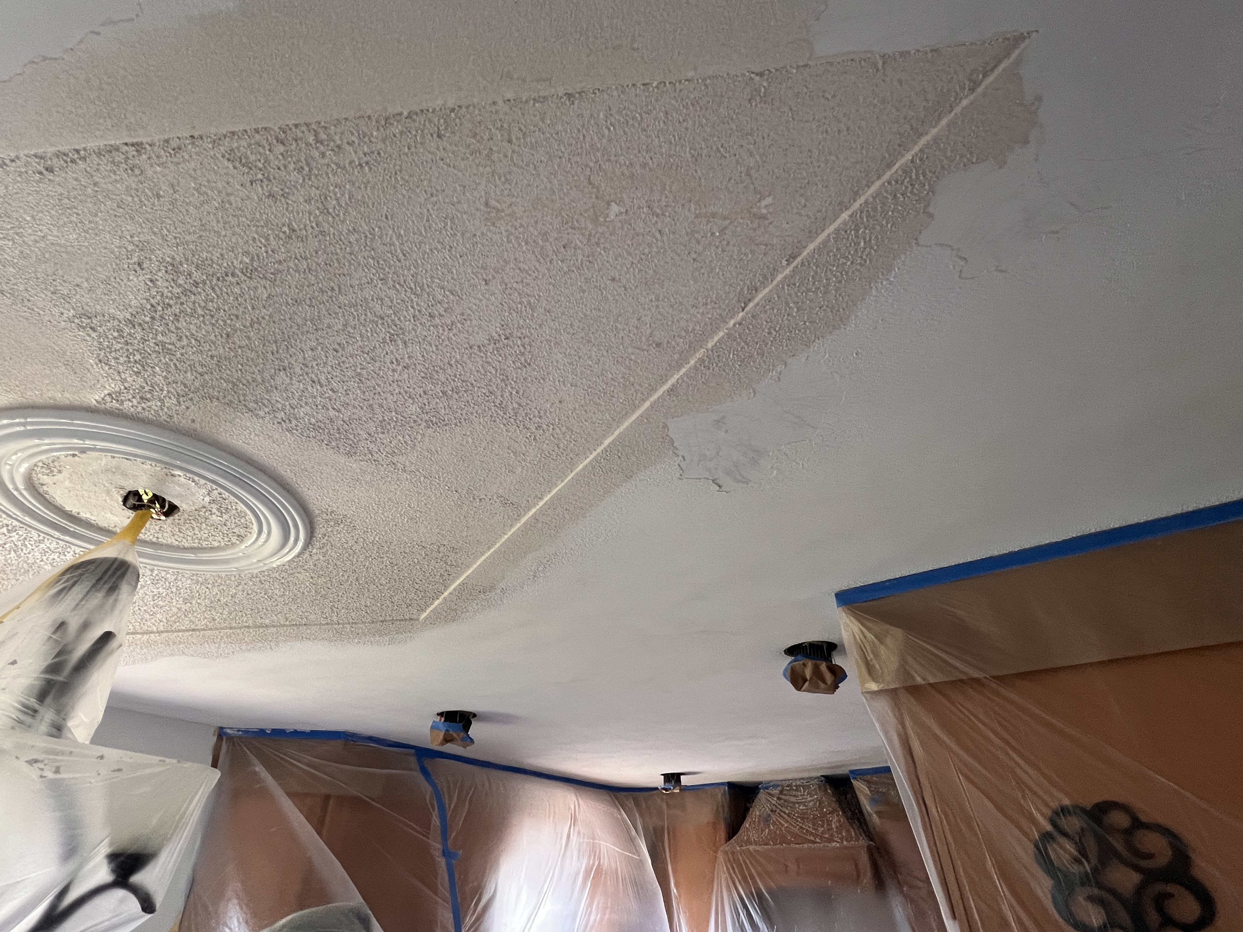 Popcorn ceiling removal in progress — photo 10 of 19